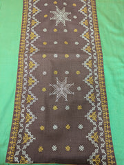 brown wildflower table runner showing embroidered wildflower motifs
